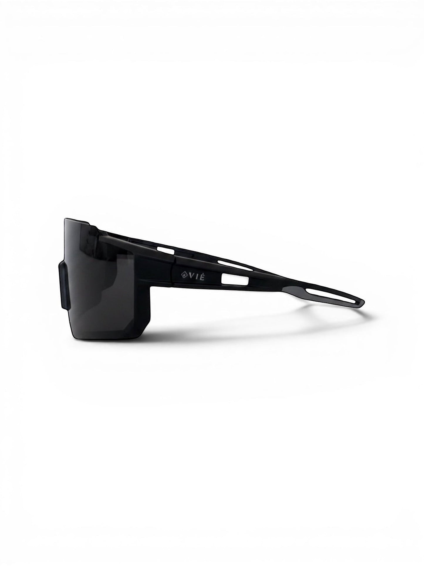 EVIE EYEWEAR black sport sunglasses with a wraparound design and grey accents on the temples, resting on a grey textured surface.