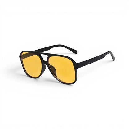 EVIE EYEWEAR Modelo Dakar black aviator sunglasses with yellow lenses and integrated logo.