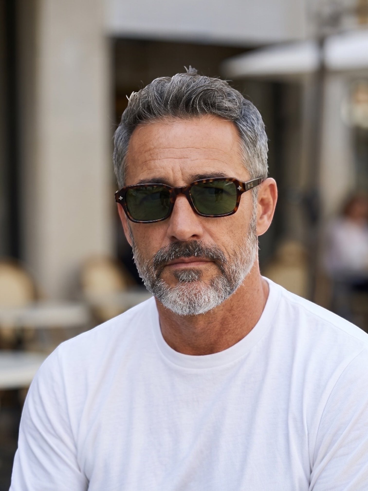 EVIE EYEWEAR OSLO CAREY rectangular sunglasses with tortoise shell frames, green lenses, and gold logo detail.