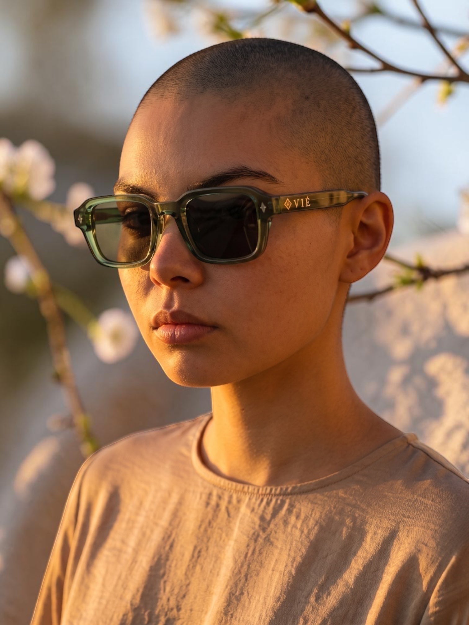 EVIE EYEWEAR OSLO MIU green acetate rectangular sunglasses with dark lenses and subtle star details.
